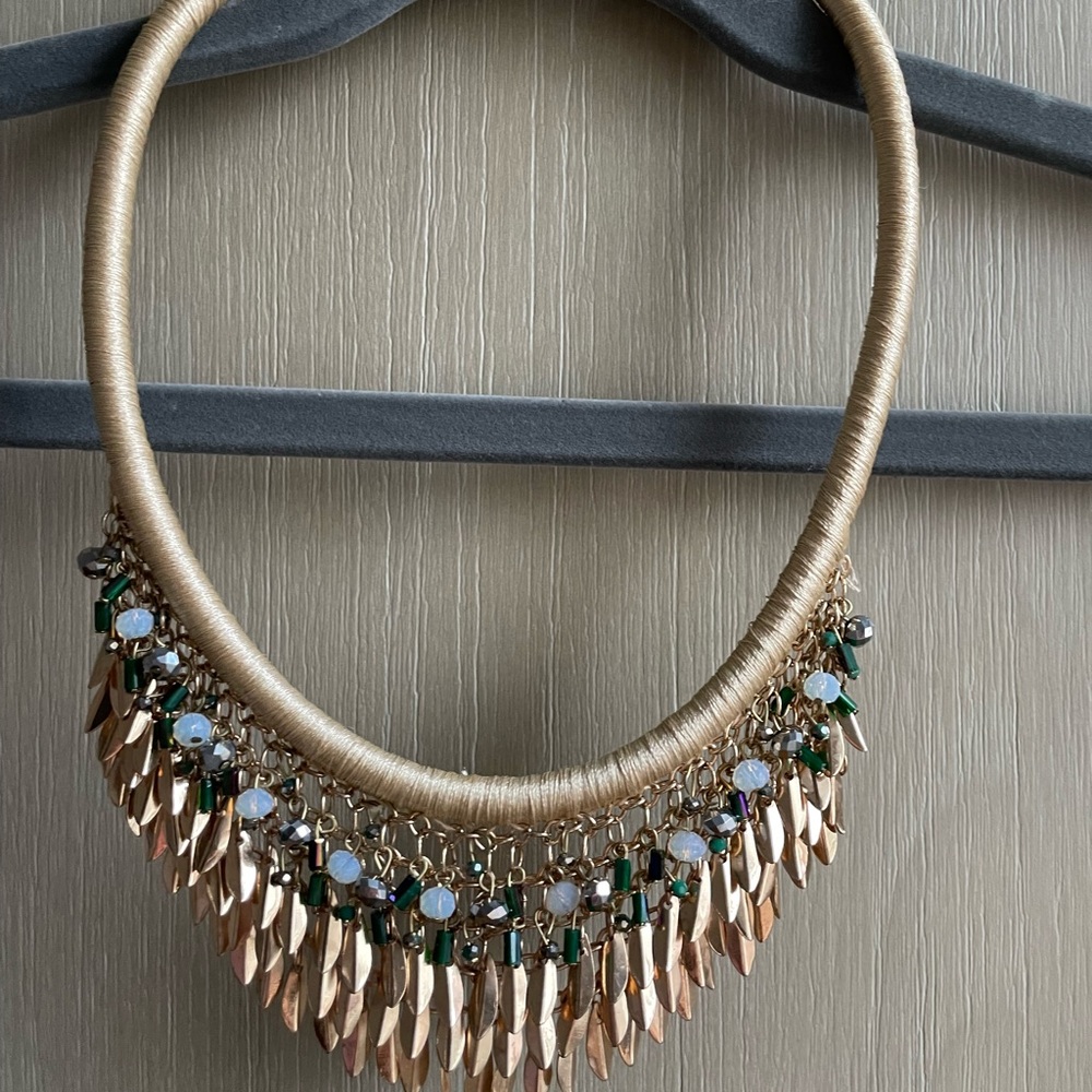 Gold cord necklace with gold and bead accents